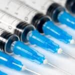 A close up image of 8 syringe tips - Injecting (Shooting) Xanax | Dangers & Effects
