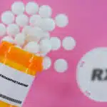 An orange prescription pill bottle that reads "Dextroamphetamine". Pills are falling out of the bottle. - Is Dexedrine (Dextroamphetamine) A Controlled Substance?