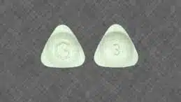 a triangle shaped Xanax with a G and a 3 imprinted into it