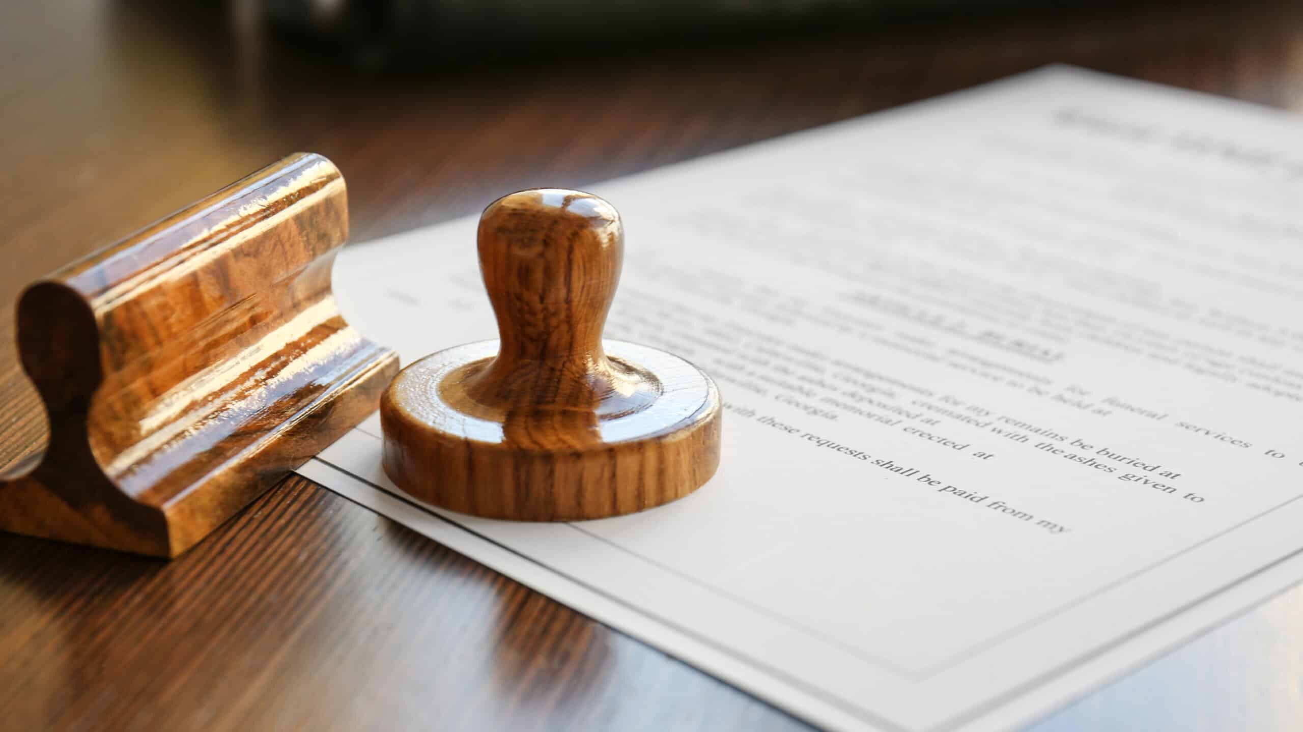 Two stampers rest on a legal document - The Importance Of Rehab Accreditation