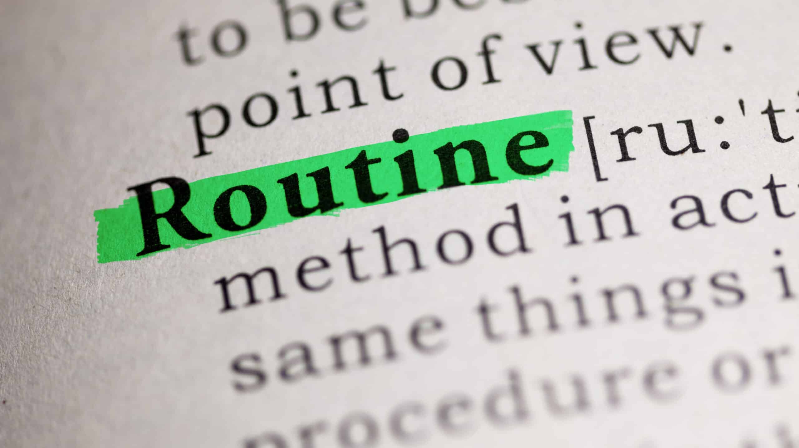 A dictionary definition page with the word "Routine" highlighted - Developing A Healthy Daily Routine In Recovery
