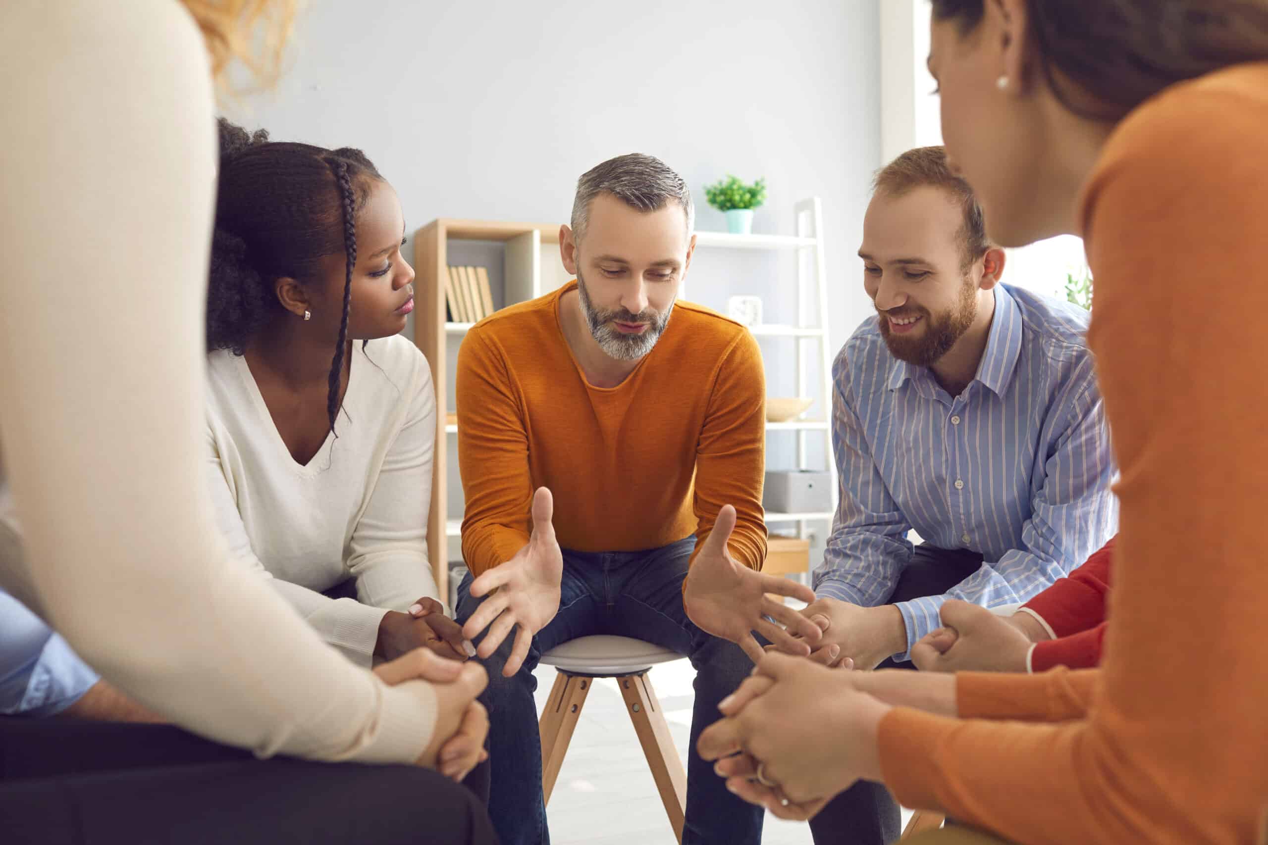 People talk while in a group therapy session - What To Expect In Alcohol & Drug Rehab